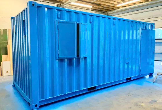 A shipping container conversion receiving its finished paintwork in the ISOv8® by ContainerKing® workshop